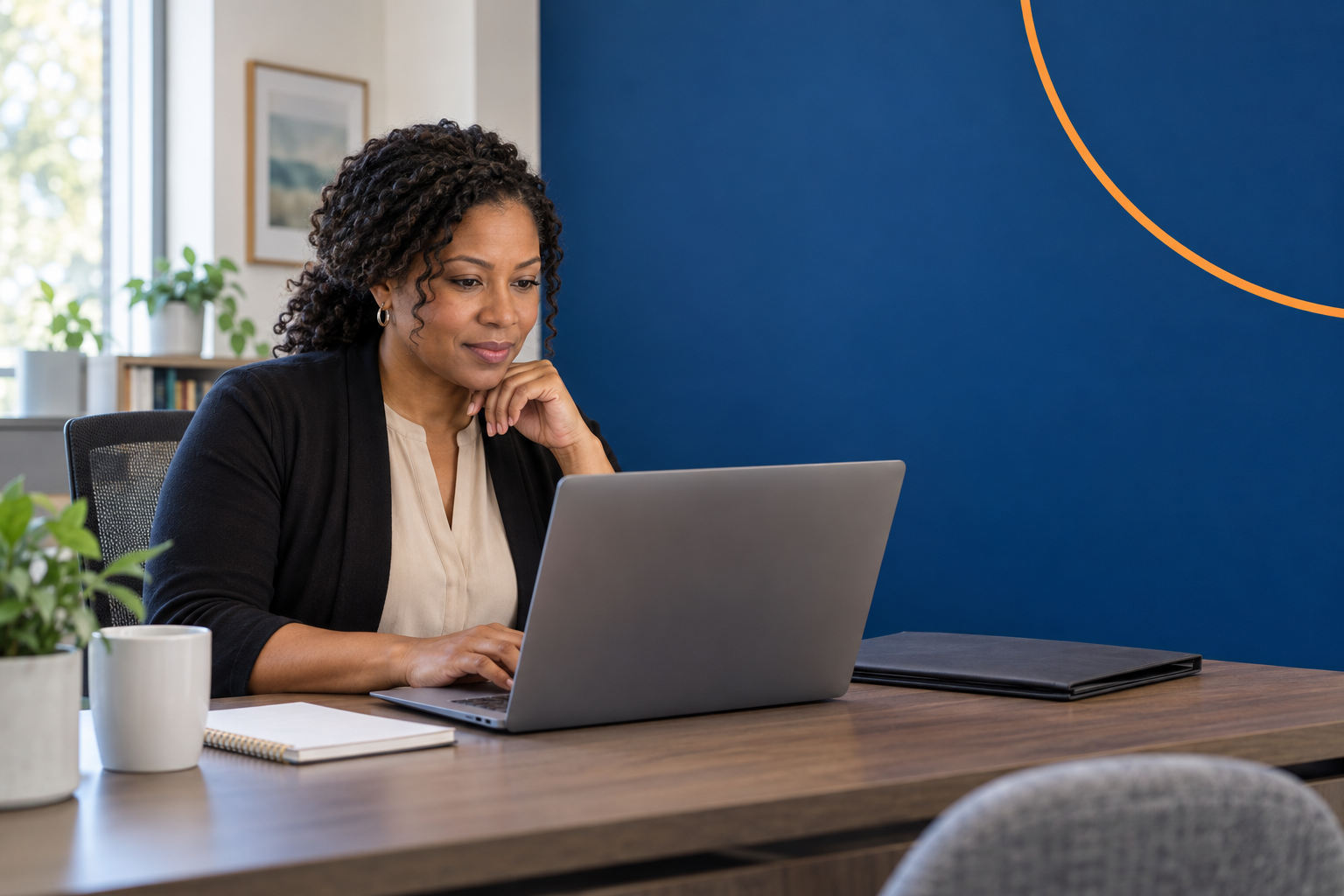 Behavioral health workforce director planning work at a laptop